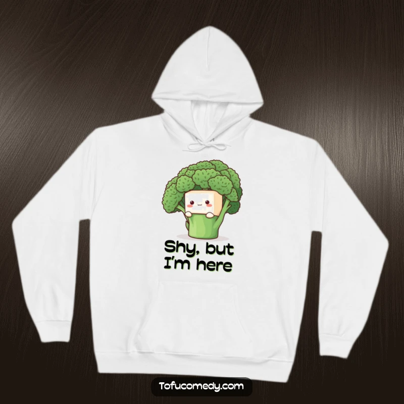 Funny Hoodie: A shy tofu cube peeking from behind a broccoli floret, offering warmth and gentle, cute humor.
